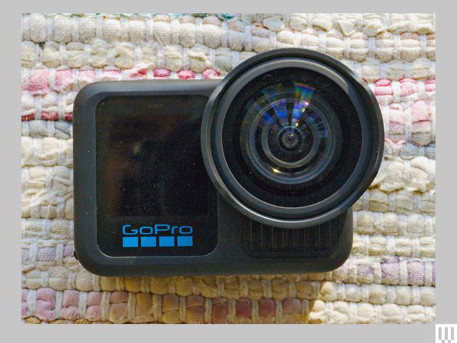 The GoPro Hero 13 Black, a small camera with a  digital screen on the left and a circular lens on the right
